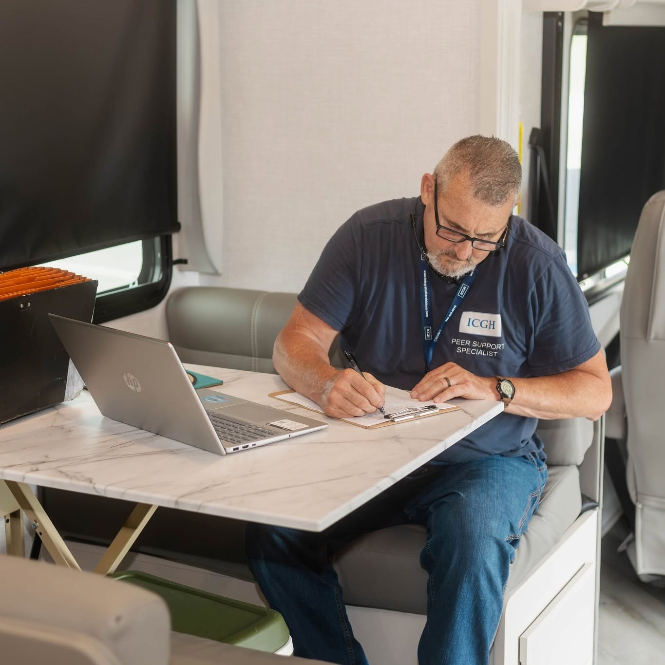 ICGH staff member working inside the mobile medical unit